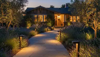 Illuminated stone walkway with ambient path lighting at dusk by Chop Chop Landscaping in Pasadena, CA